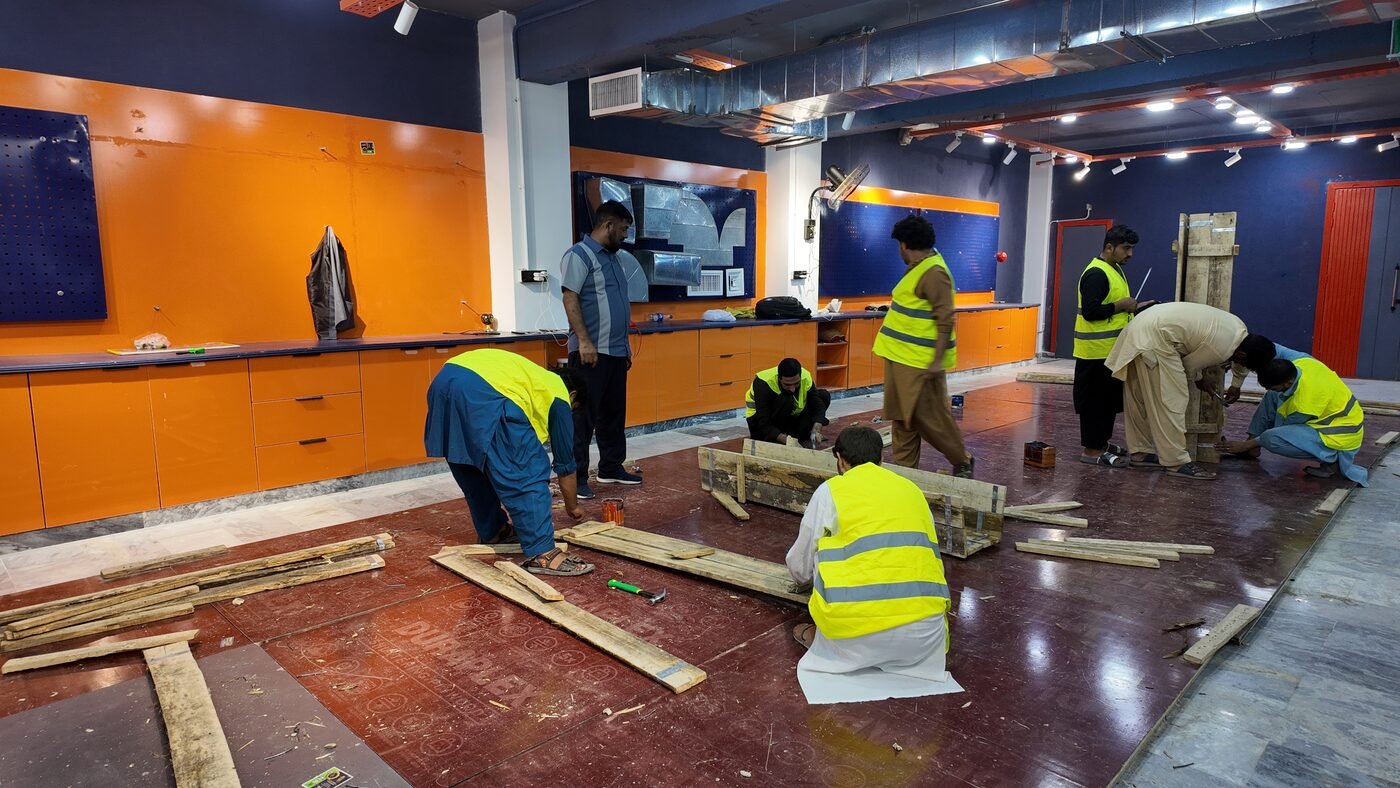 Trainees working through a structural assembly exercise